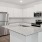 a kitchen with white cabinets