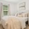 a bedroom with a bed and a table