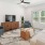 a living room with a tv and couches