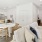 a large kitchen with a dining table and couches