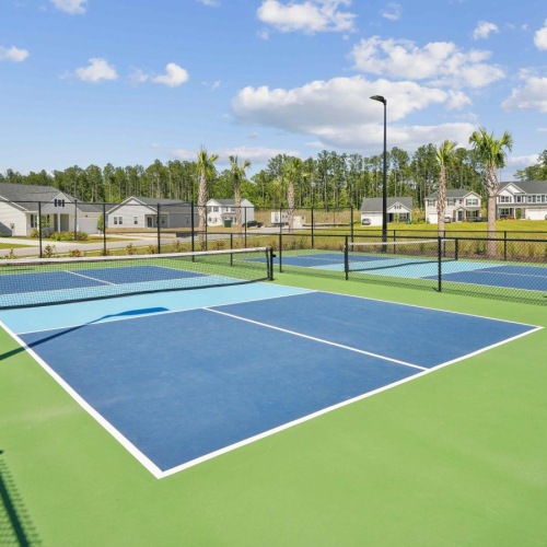 Thoughtful details to elevate your lifestyle a tennis court with a fence around it