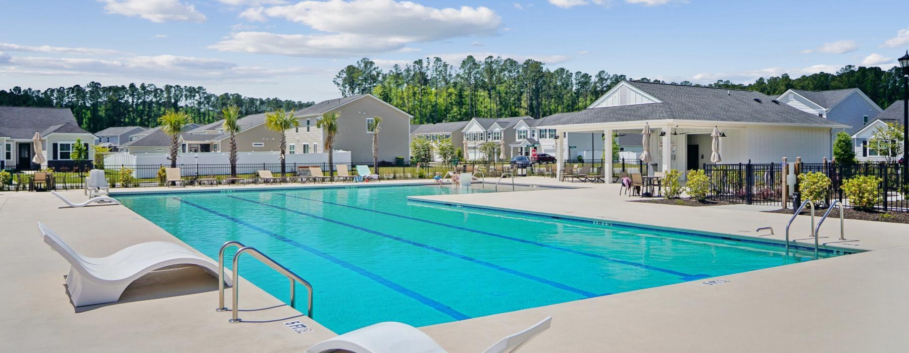 a swimming pool with lounge seating