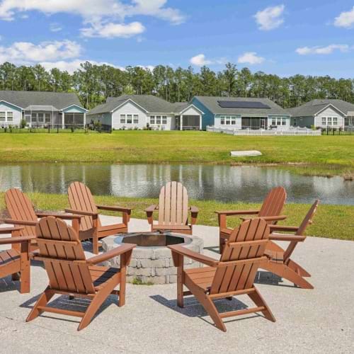 Settle into comfort at Retreat at New Riverside a group of chairs on a deck