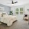 a bedroom with a bed and a mirror