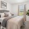 a bedroom with a bed and a mirror