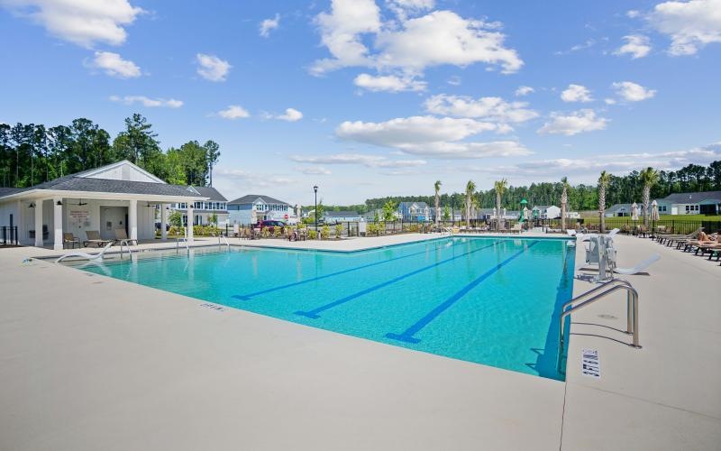 a swimming pool with a building in the background